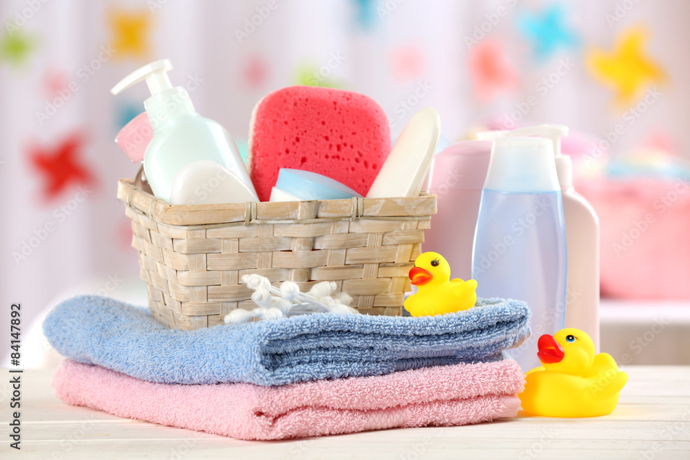 Baby accessories for bathing on table on light background Baby accessories for bathing on table on light background