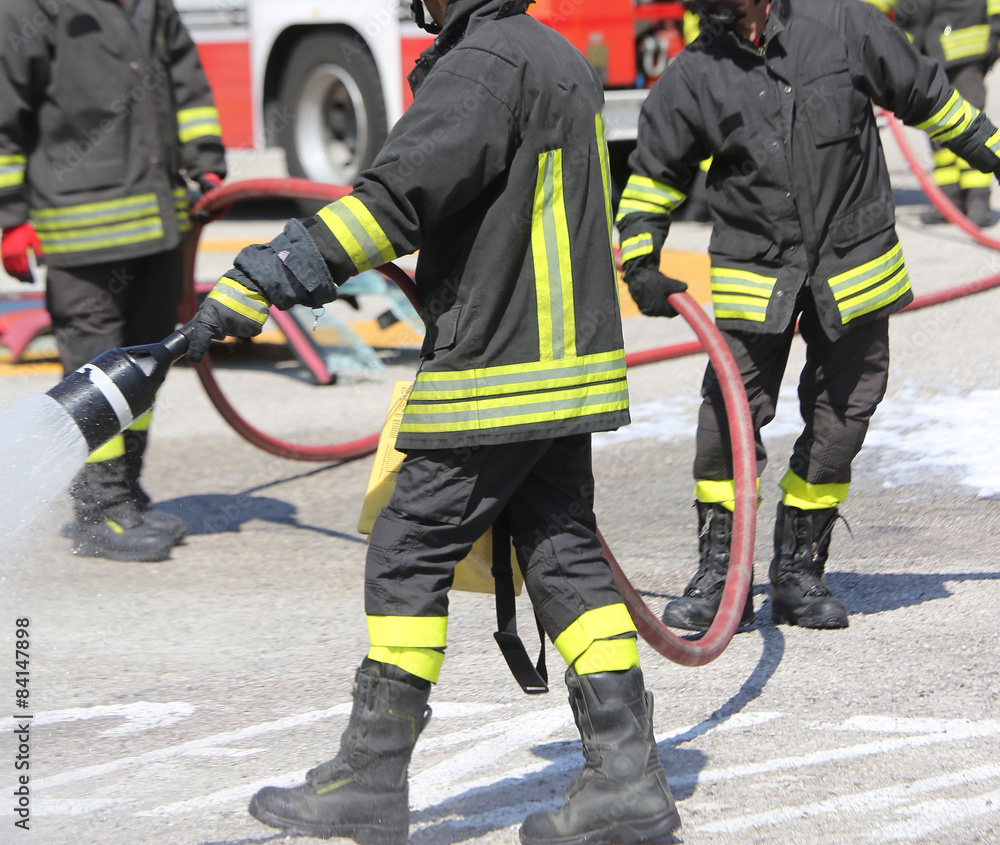 firefighters with the fire extinguishe at Fire department firefighters with the fire extinguishe at Fire department