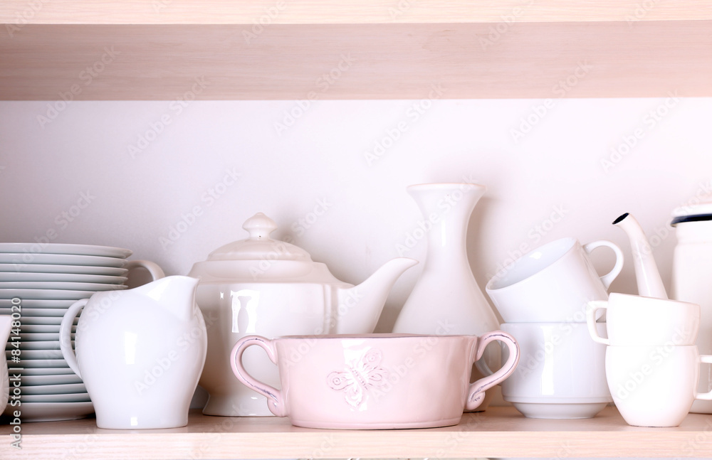 Kitchen utensils and tableware on shelf Kitchen utensils and tableware on shelf