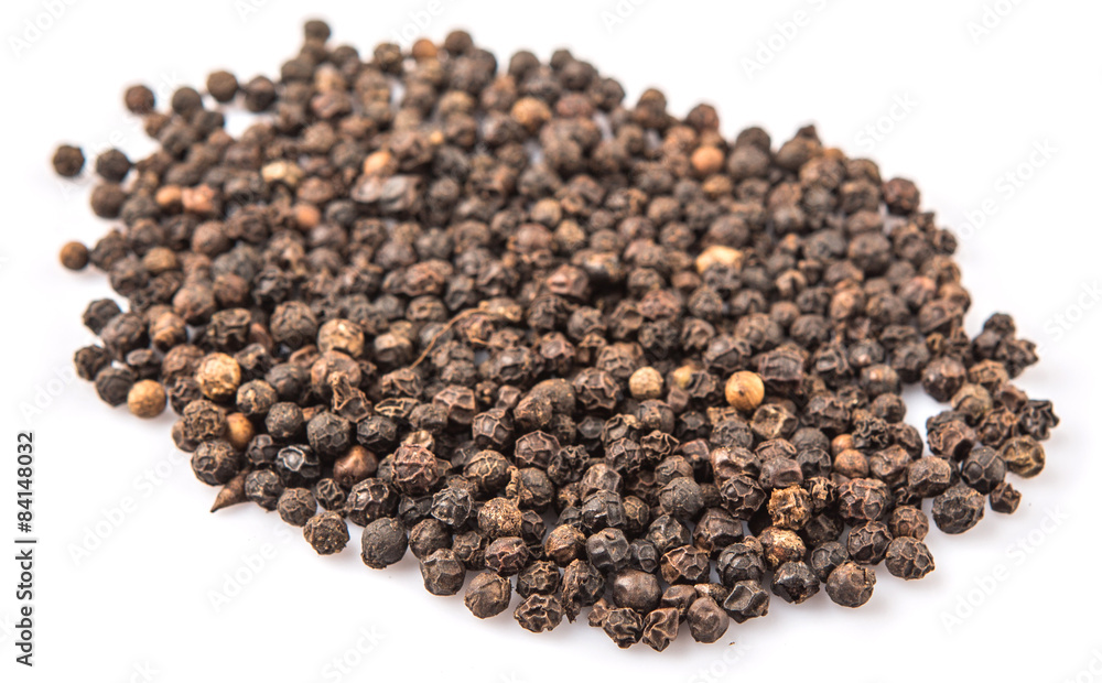 Black pepper over white background Black pepper over white background