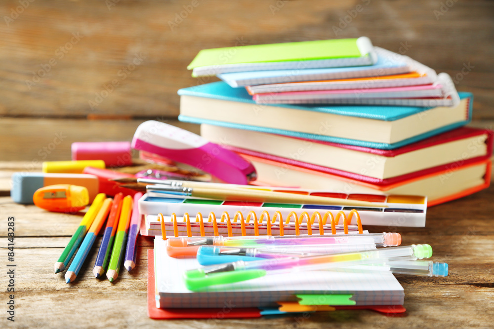 Fototapeta premium Bright school stationery on old wooden table