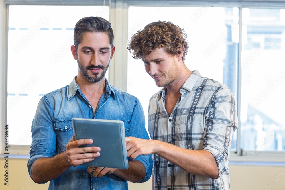 Fototapeta premium Business team looking at tablet