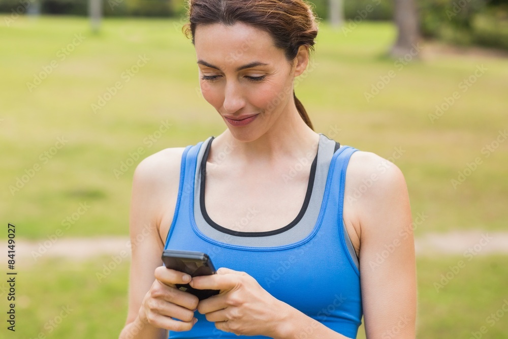 Pretty brunette using smartphone Pretty brunette using smartphone