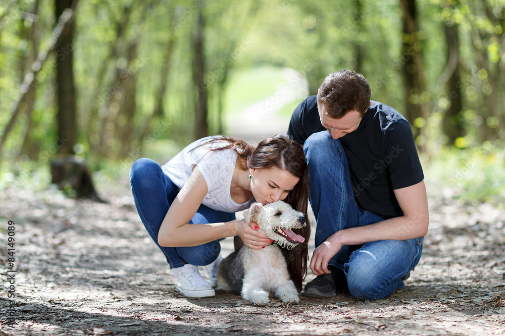 Fototapeta premium Happy young couple and dog