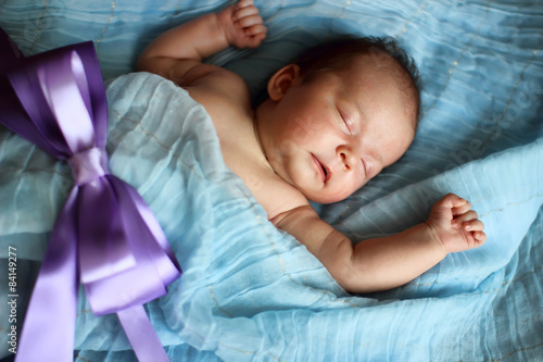baby sleeping in his little bed.