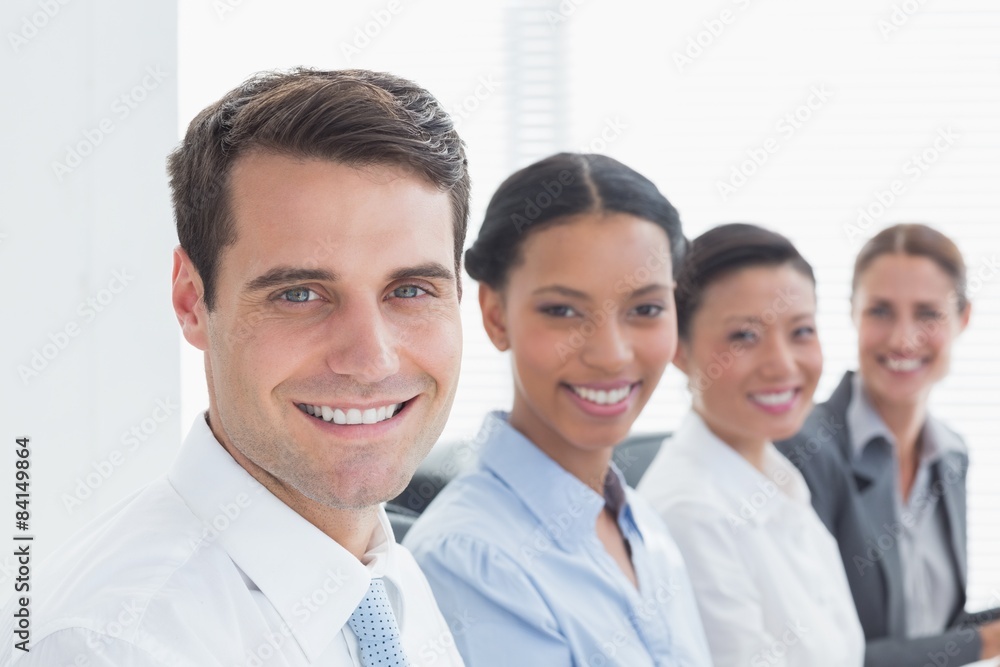 Smiling business people looking at camera Smiling business people looking at camera