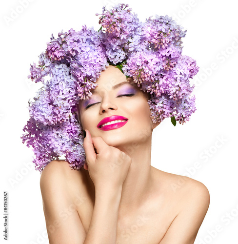 Fotografie Beauty fashion model girl with lilac flowers hairstyle