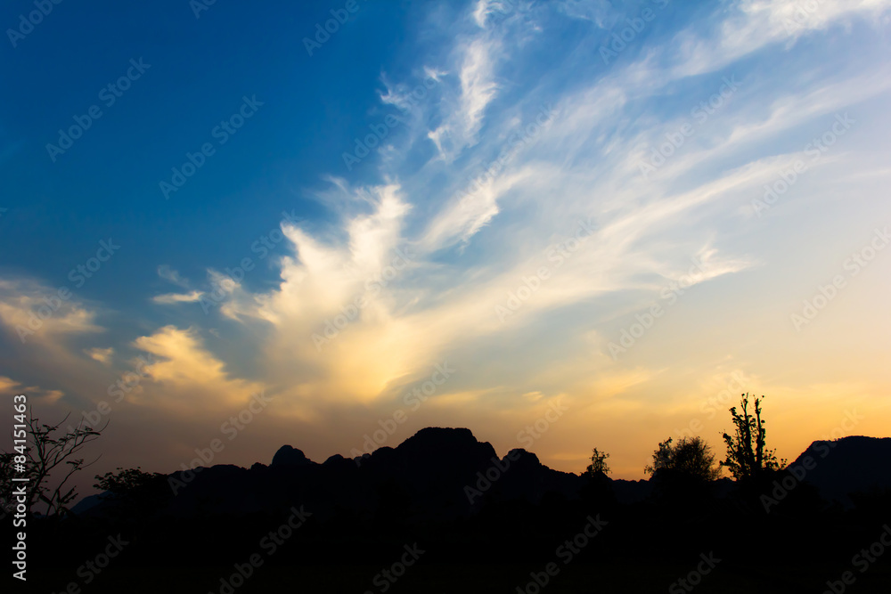 Bright sunset in sky over Vang Vieng landscape, LAOS.