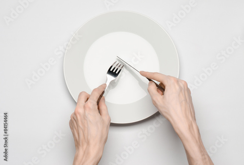 the human hand show gesture on an empty white plate in studio