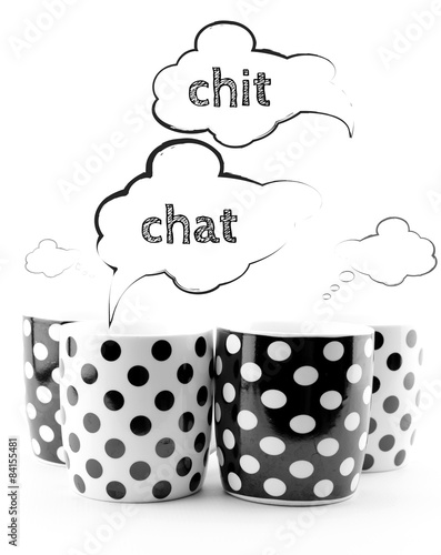 Fotografie Coffee mugs with speech bubbles Chit chat isolated on white
