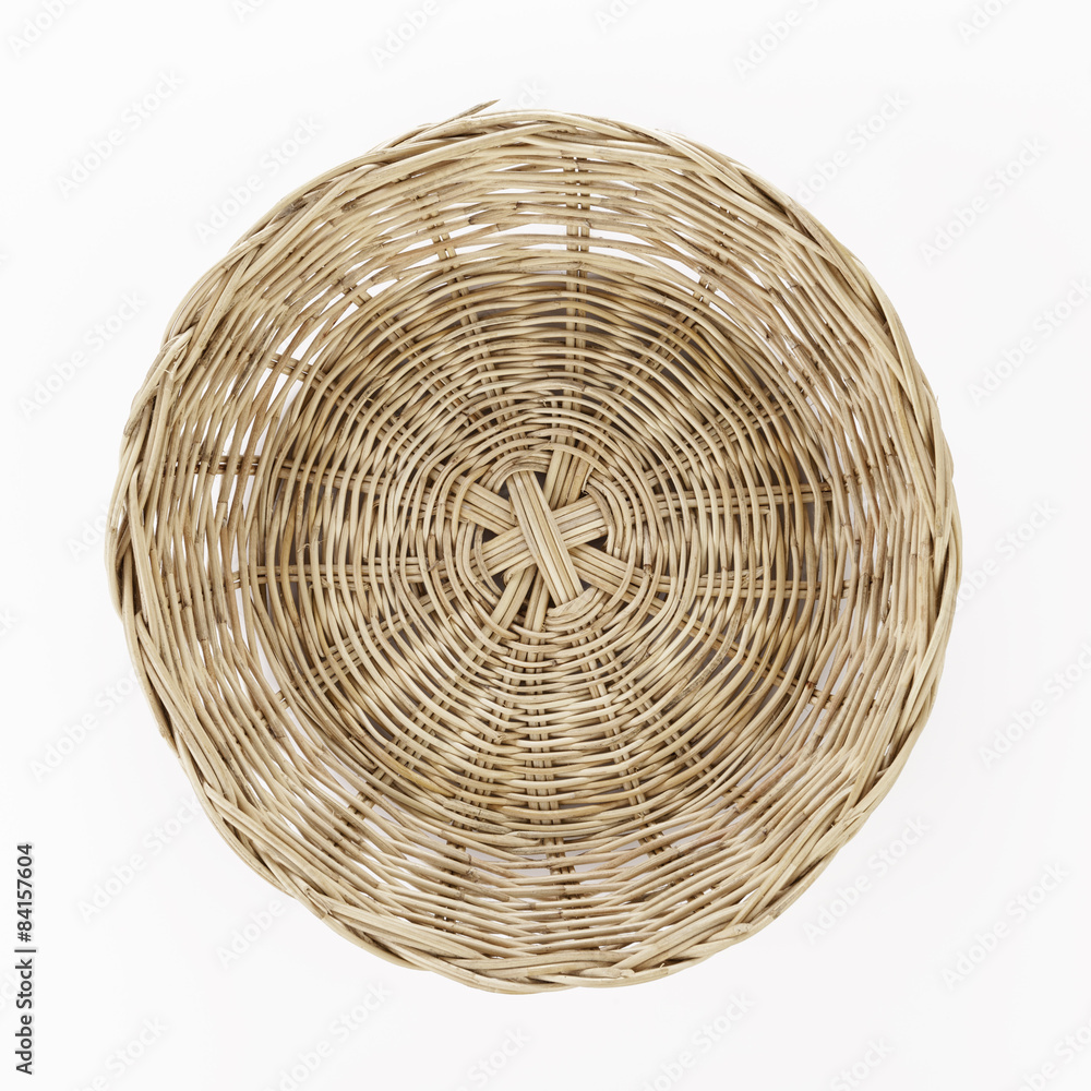 Obraz premium Brown wicker basket on white background, top view