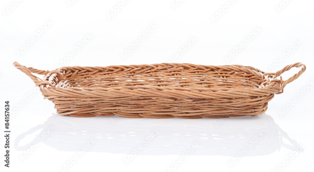 Fototapeta premium Brown wicker basket on white background, side view