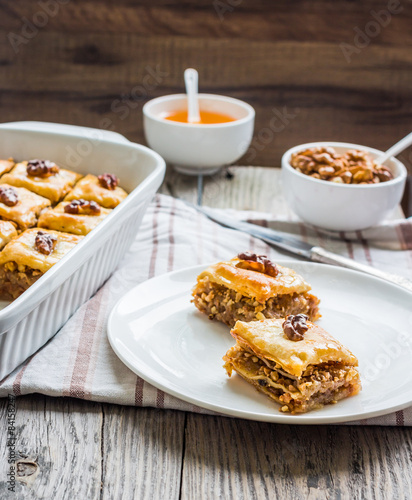 pieces of baklava with honey and nuts, rustic,  Turkish dessert
