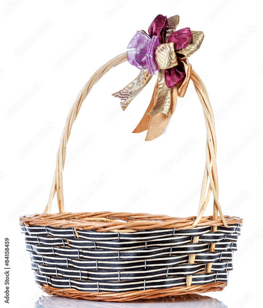 Empty wicker basket with ribbon isolated on white background