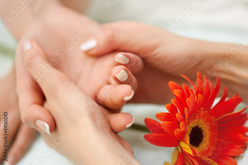 Hand Massage. Beautiful Blonde Gets Spa Treatment in Salon.