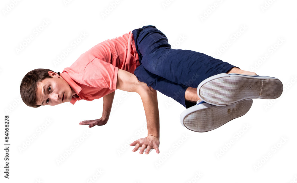 Break dancer doing handstand against  white background