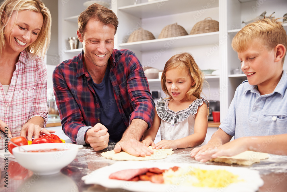 Family making pizza together