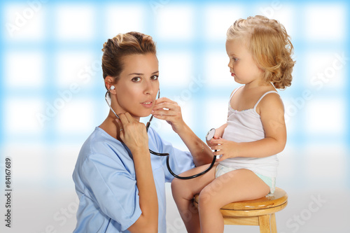 Doctor examining a baby girl