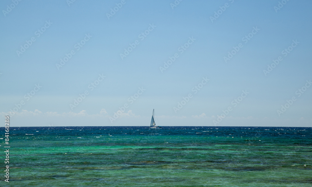 Boat in the blue sea