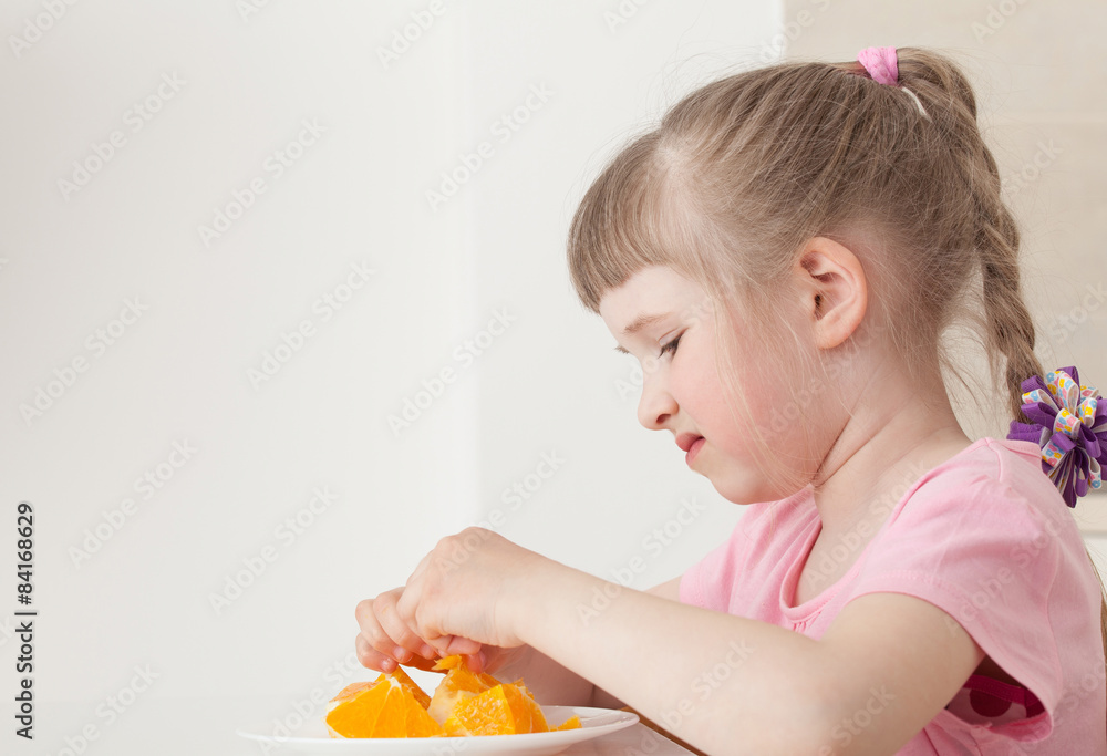 Little girl don't want to eat an orange Little girl don't want to eat an orange