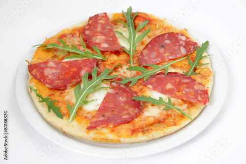 Pepperoni pizza in white plate