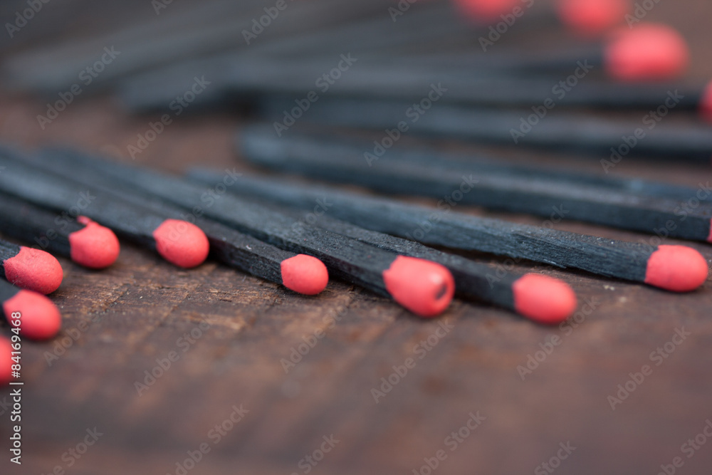 Naklejka premium Black and red matches