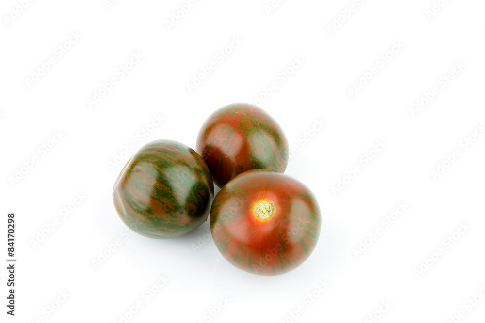 a fresh tomato with odd colors on a white background a fresh tomato with odd colors on a white background