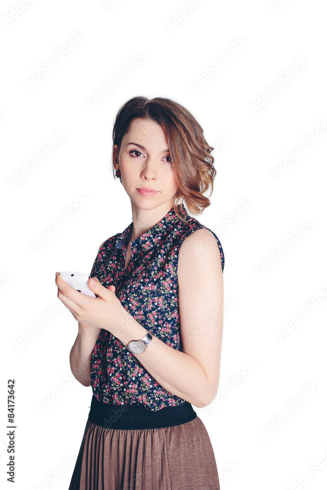 Beautiful business woman holding a mobile phone on a white background isolated Beautiful business woman holding a mobile phone on a white background isolated