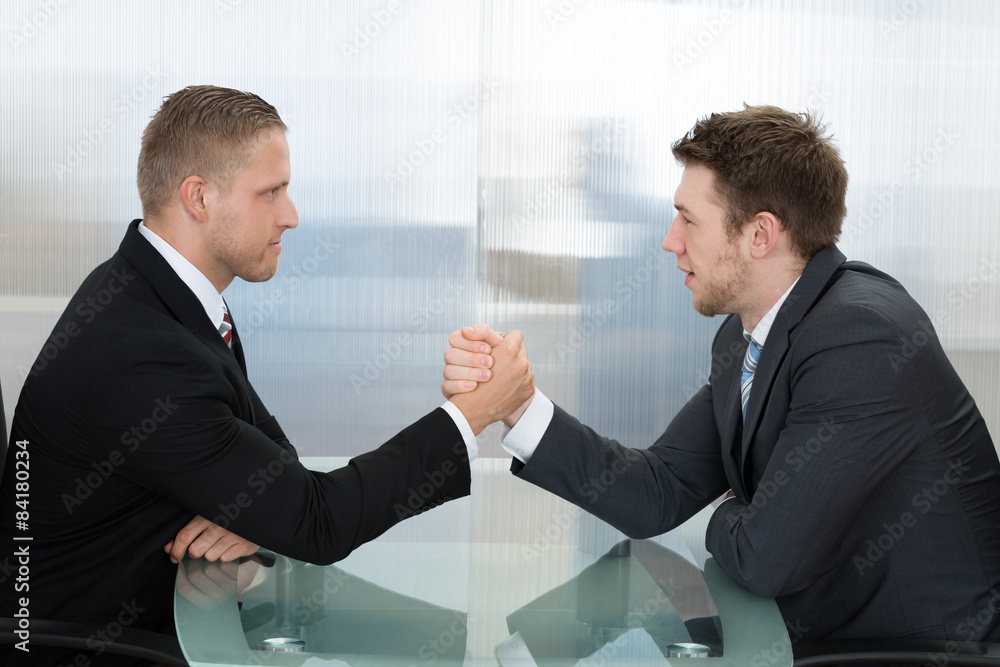 Fototapeta premium Two Businessman Wrestling