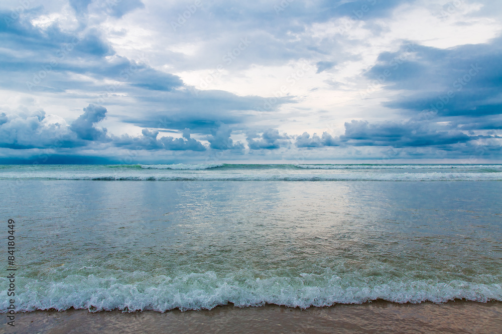 Tropical beach and beautiful sea. Blue sky with clouds in the ba Tropical beach and beautiful sea. Blue sky with clouds in the ba