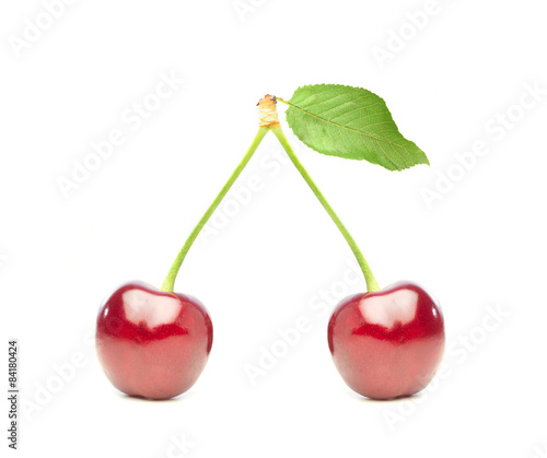 two shiny red cherries