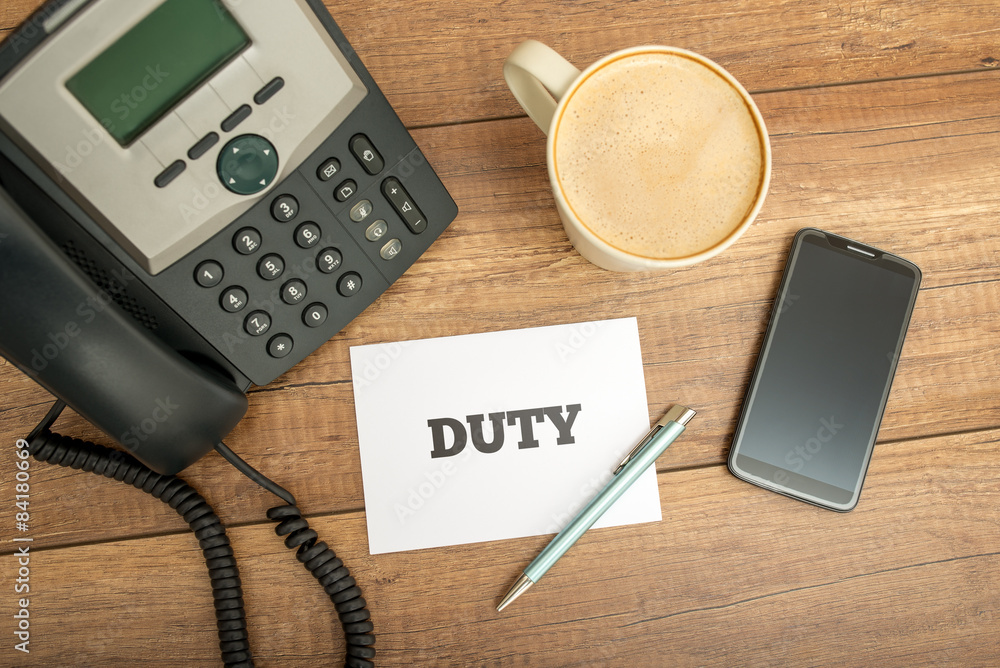 White Card with Duty Text on Top of Worktable White Card with Duty Text on Top of Worktable