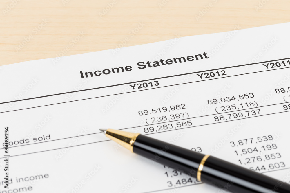 Income statement financial report with pen Income statement financial report with pen