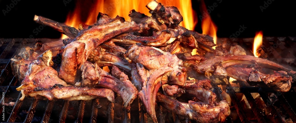 Racks Of Lamb On The Hot Flaming BBQ Grill