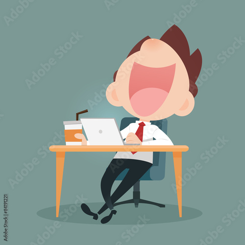 Businessman working on laptop and drinking coffee