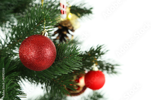 Christmas baubles on christmas tree on white background