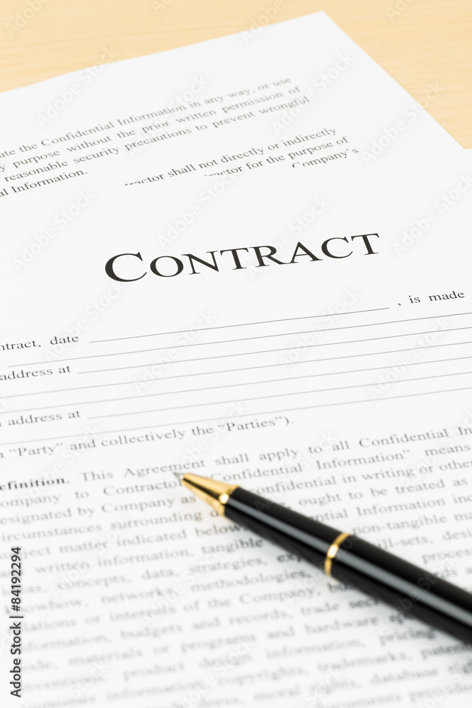 Business contract with pen; document is mock-up Business contract with pen; document is mock-up