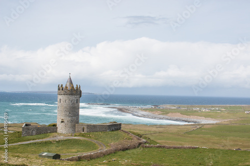 Doonagore Castle and the Aran Islands near Cliffs of Moher Ireland