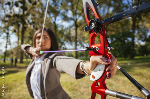 Businesswoman Practicing Archery