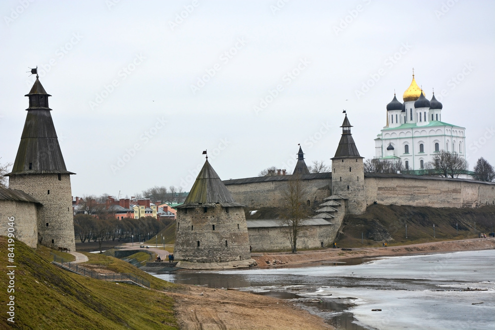 Stone tower and Pskov Kremlin fortress wall at the confluence of two rivers