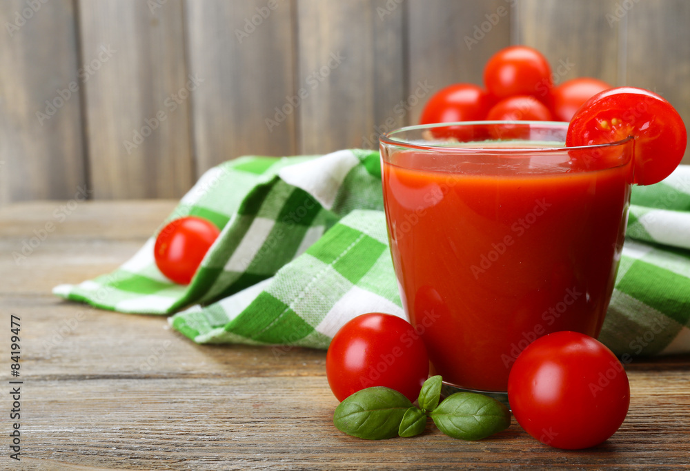 Glasses of tomato juice with vegetables on table close up Glasses of tomato juice with vegetables on table close up