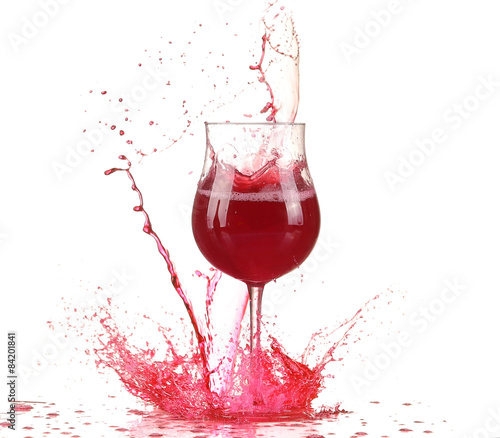 Glass with red wine splash
