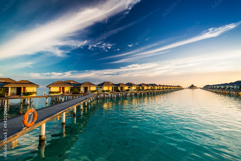 Fototapeta premium Sunset time on island of Maldives over the bridge connecting bun