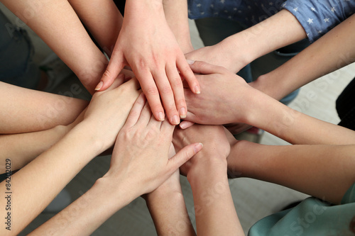 Group of female hands together  closeup