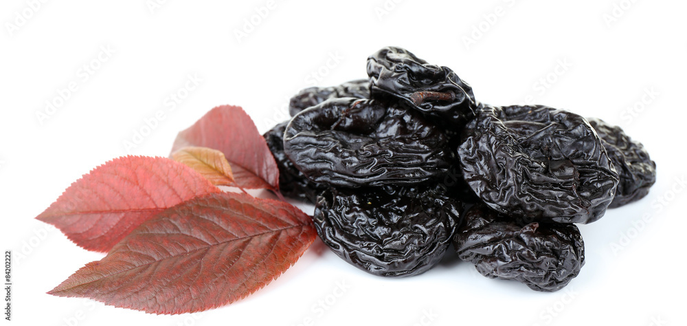 Pile of prunes with leaves isolated on white Pile of prunes with leaves isolated on white