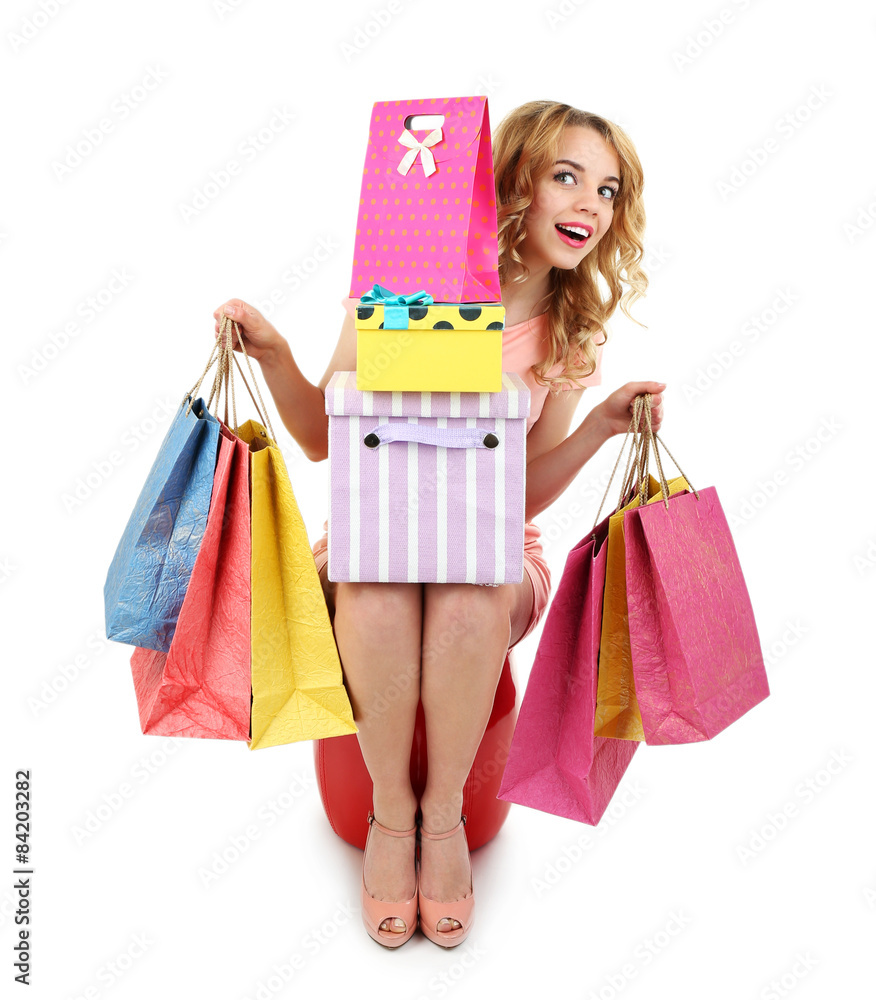 Beautiful young woman with shopping bags and boxes isolated on white Beautiful young woman with shopping bags and boxes isolated on white