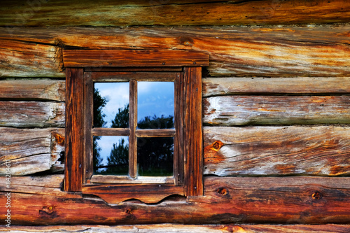 Wooden wall with old window