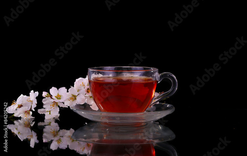 cup of tea and cherry branch