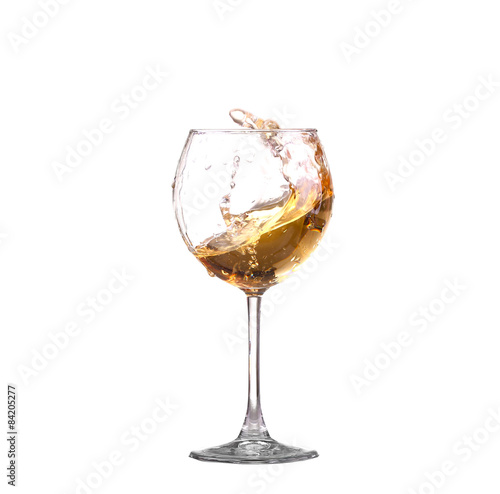 white wine splash before white background photo