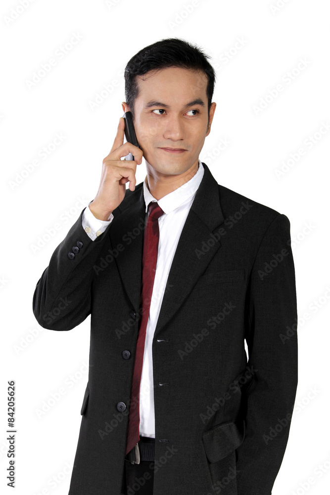 Casual pose of businessman on phone, isolated on white Casual pose of businessman on phone, isolated on white